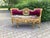 A beautiful 1950s French Louis XVI–style settee, combining a finely carved solid beechwood frame with sumptuous burgundy...