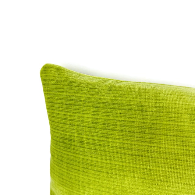 From Schumacher is Antique Strie Velvet in the color Lime pillow cover. This pillow features a vibrant apple green color...