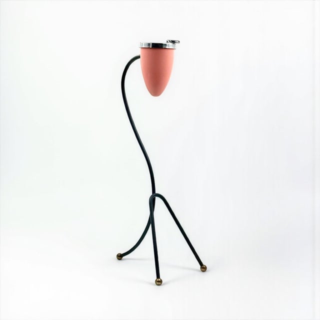 Elegant Italian modernist floor ashtray produced during the 1960s. The piece features a slender curved black lacquered...