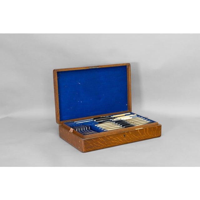 Oak cased 12 person cutlery canteen by Walker and Hall of Sheffield. Circa 1920 This piece has an attribution mark, I am...