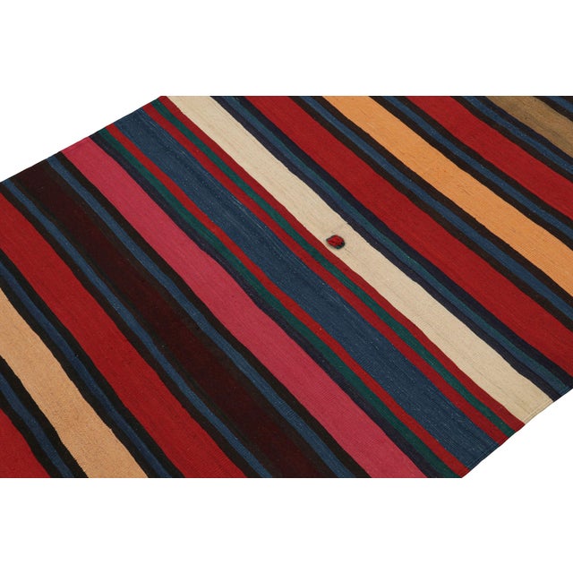 This vintage 2'11.5''x10'3'' Shahsavan Persian kilim is handwoven in wool, and originates circa 1950-1960. On the Design:...