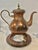 This is an early 20th-century Swedish copper and brass coffee service by Oscar Nilsson of Eskilstuna, Sweden, a metalworks...