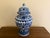 A classic blue and white ginger jar, decorated throughout with a delicate flowering branch motif. The pattern is dense yet...