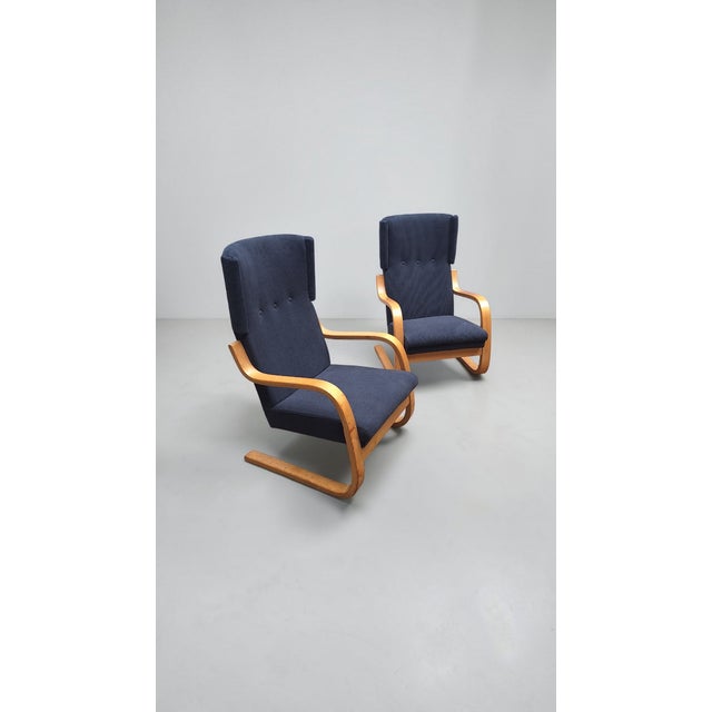 Pair of armchairs, model 36/401, by Alvar Aalto for Artek (Finland), 1970s (designed in 1933). Birch plywood frame and...