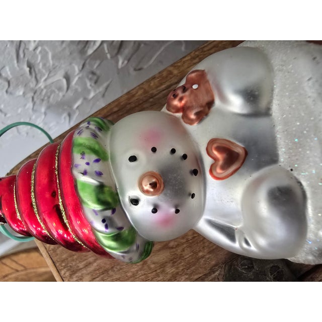 A delightful vintage hand-blown glass Christmas ornament from DEMDACO, designed by American Artist Gail Flores. This...