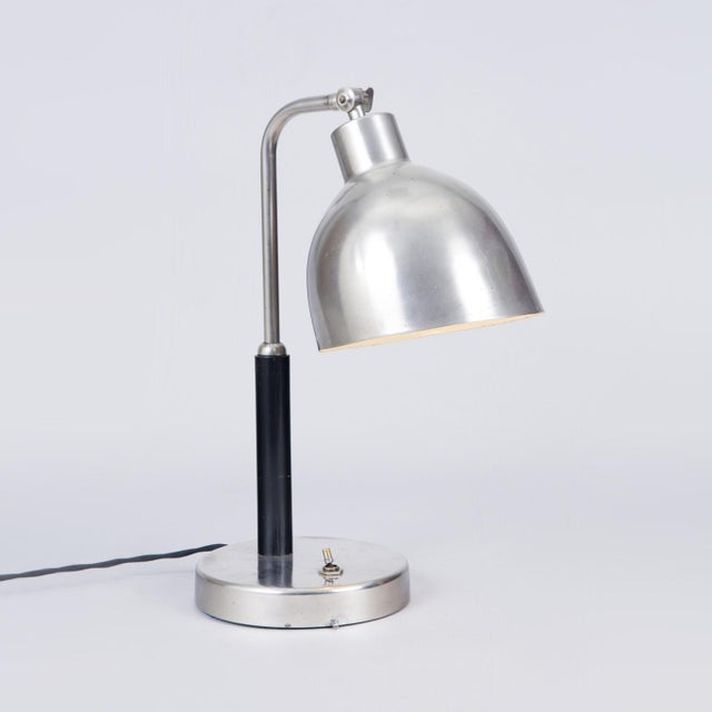 This elegant table lamp dating back to the 1920s was manufactured in Czechoslovakia and represents an exemplary, highly...