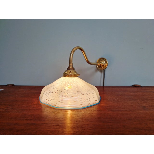 Brass swan-neck wall sconce with blue speckled glass shade from the 1930s, from the French glassworks of Clichy. Very good...