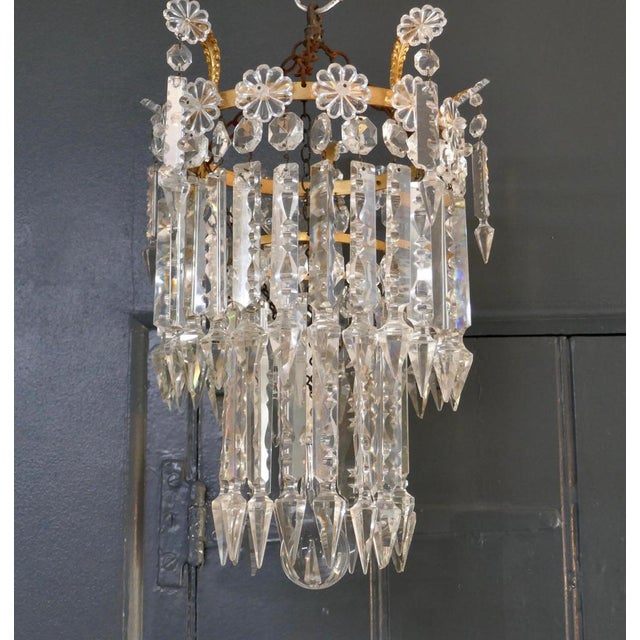 A Stunning Waterfall 2 Tier Crystal Chandelier A Charming waterfall tiered pendant chandelier, this delicate though heavy...