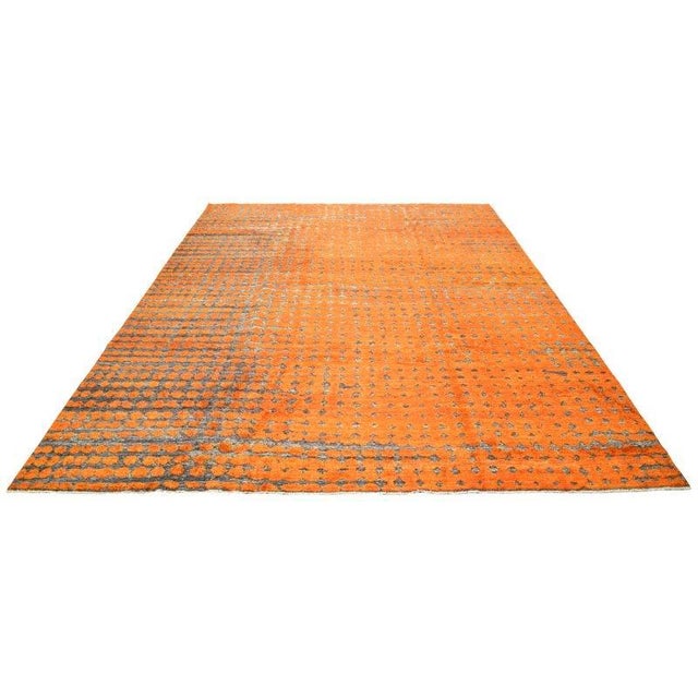 Moroccan hand knotted wool rug with abstract design.