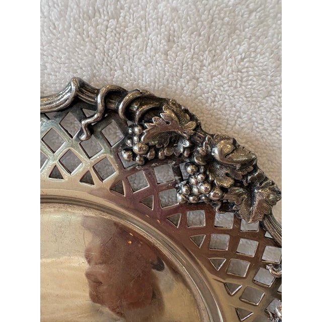 Ornately designed plate with an elegant lattice pattern donned with a grapevine trim. Hallmarks of the Passat Lion...