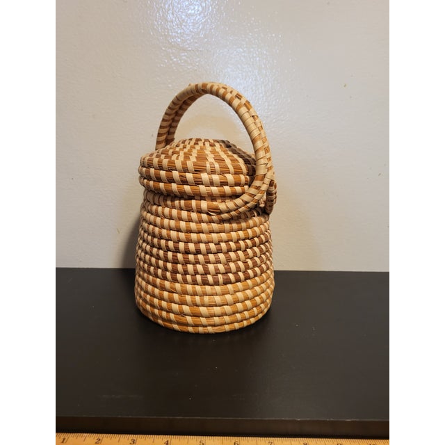 Sweetgrass basket tray handcrafted with handle and lid. Materials used to create such beauties include sweetgrass,...