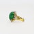 18K Ring with approximately 8.00 carat jade cabochon and 12 round diamonds weighing 0.18 carats. 9.02 grams