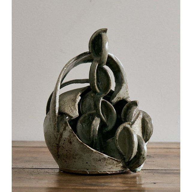 Vintage ceramic sculptural vessel with an organic, hand-built open-form design, France. This small scale sculpture is a...