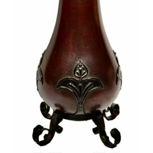 This is an original Bradley & Hubbard Manufacturing Company banquet oil lamp. The base section is a teardrop or pear-...
