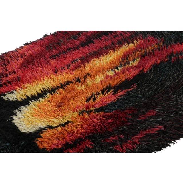 Hand-knotted in lush, high-pile wool in Sweden circa 1960-1970, this 2x4 vintage Swedish Rya runner rug is a bold new...