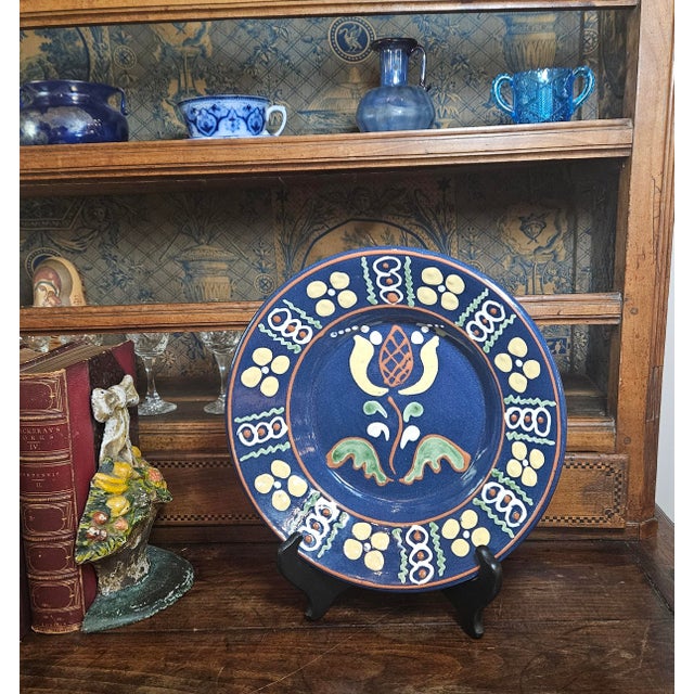 This item is a piece of Westmoore Pottery, a type of slip-decorated redware made in Seagrove, North Carolina. This...