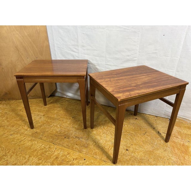 A fantastic and increasingly rare pair of mid century modern teak side tables dating from the 1960s–1970s, offering...