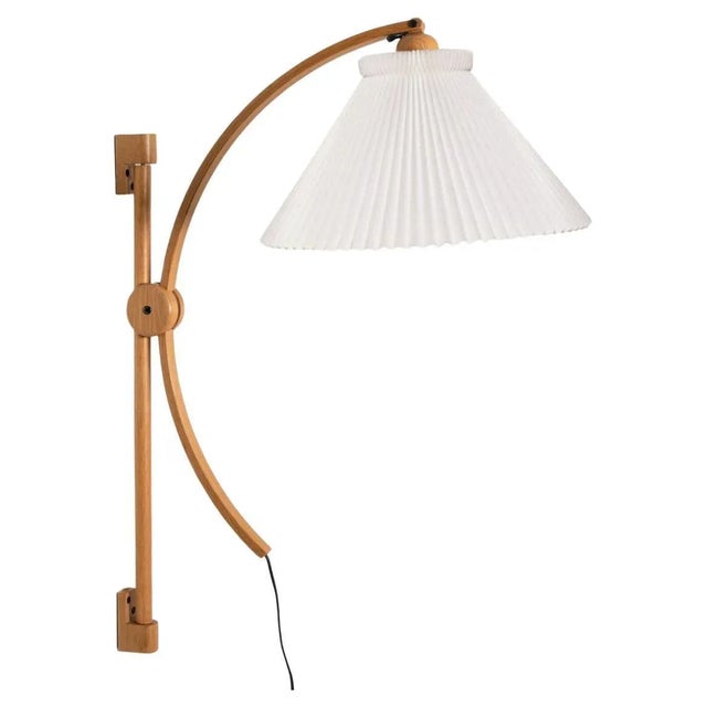 Pair of wonderful oak wall lights with new lampshade by Le Klint. The light is manufactured by Domus in the 1970s in...