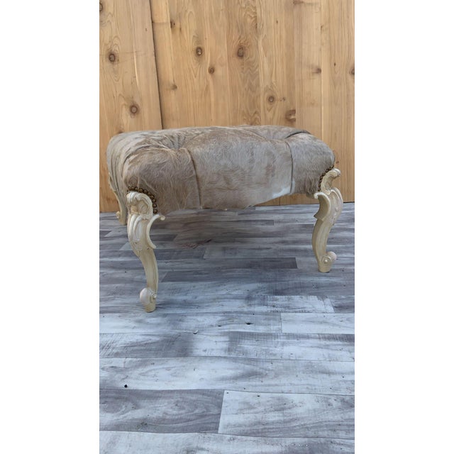 Vintage French Provincial Style Tufted Ottoman with Hand Carved Cabriole Legs Newly Reupholstery in a Brazilian Cowhide...