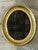 Wood Vintage Gilt Oval Wall Mirror For Sale - Image 7 of 12