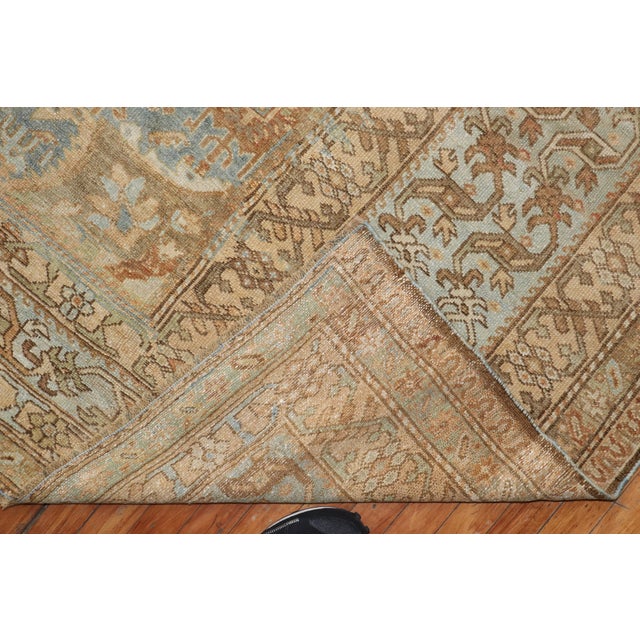 an early 20th Century Antique Malayer corridor size rug in light blue and sand tones Measures: 8' x 19'4".