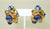 A beautiful pair of 1980's Antigona Paris gold plated clip-on earrings accented by sapphire blue poured glass cabochon...
