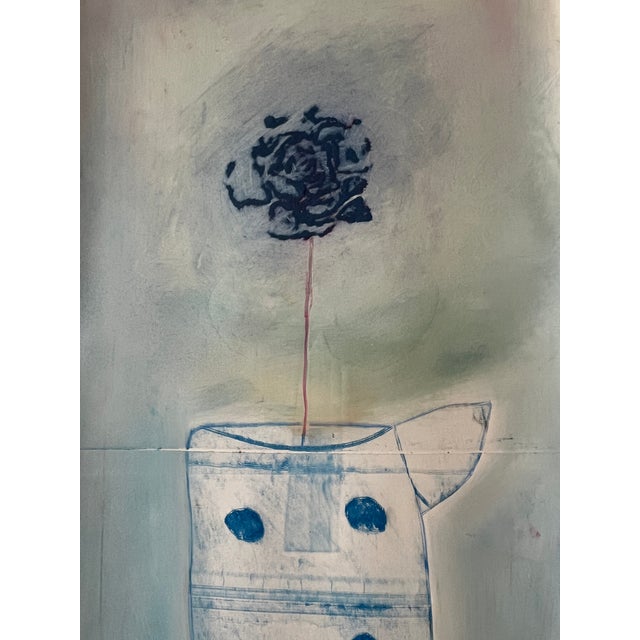 This is a print on coated blue paper. The print portion is the vase. The flower is drawn onto the surface. This is...