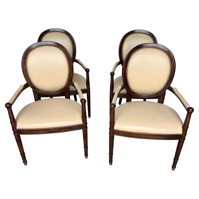 Set of Four Baker Milling Road Neoclassical Mahogany & Parchment Leather Armchairs with Bronze Sabots This set of four...