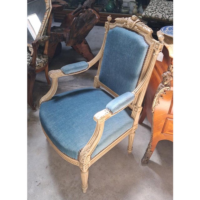 Louis XVI Style Armchair in Lacquered Wood, Upholstered in Blue Velvet An elegant Louis XVI style armchair with a flat...