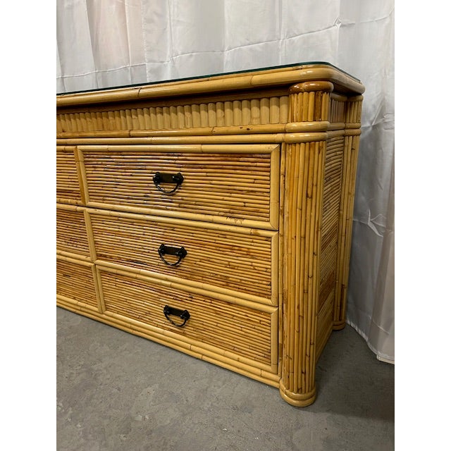 Chic 20th Century pencil reed rattan dresser to add a touch of coastal to your space.