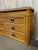 Chic 20th Century pencil reed rattan dresser to add a touch of coastal to your space.