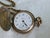 An antique late Victorian (circa 1890–1900) ladies’ guard chain and Illinois pocket watch ensemble. The double-rope guard...