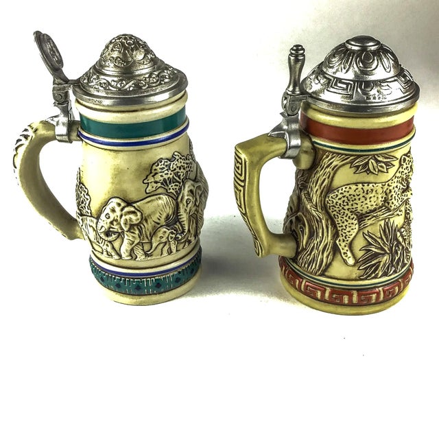 Pewter covers and a theme embracing endangered species this pair of steins is perfect for animal lovers or beer drinkers....