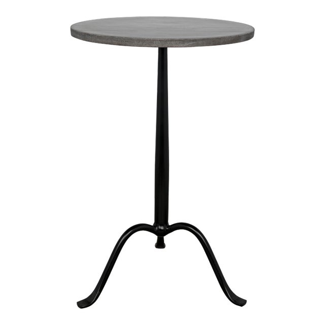 A tripod base in metal rises gracefully to support a top comprised of an elegant circle of marble. The look is easy,...