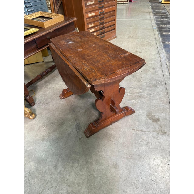 Small provincial Italian walnut drop leaf table. Small enough to be used as a coffee table. 32”dia x 22”h