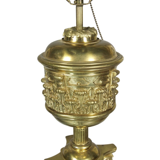 Originally an oil lamp with decorated font over a Corinthian capitol and fluted columnar support, square base and brass...
