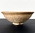 A modern ceramic Chawan (Tea Bowl) by potter Hino Yoshinaga (active post 1940s). Hand-molded and glazed in a white glaze....
