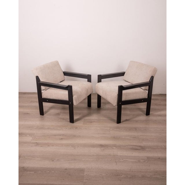 Pair of armchairs with black wooden structure and gray fabric covering, 1980s, Italian design.