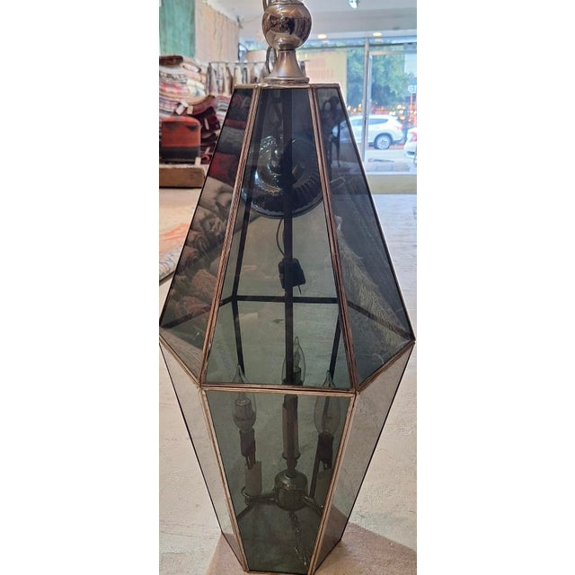 Mid Century smoked Glass light pendant chandelier. This id a classic Mid Century chandelier the glass light panels that...
