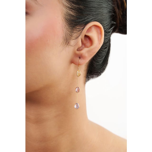 Add a touch of natural beauty and colorful elegance to your jewelry collection with these unique multicolor sapphire drop...