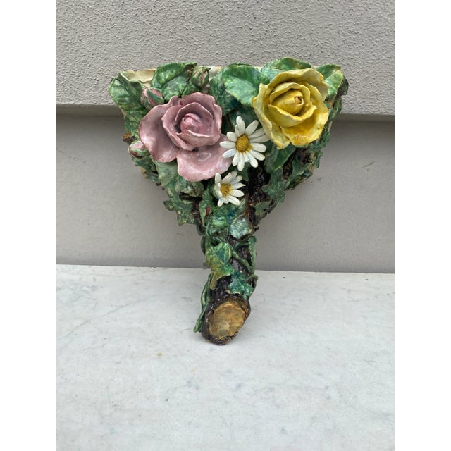 19th century French Majolica sconce with roses and daisies.
