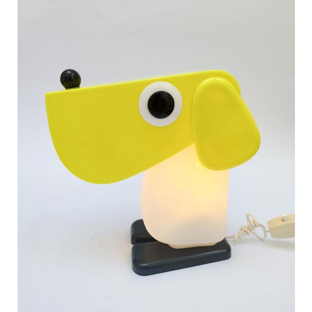 Table lamp rufus the dog, designed by fernando cassetta for tacman vintage 1970s black plastic base, white body, and...