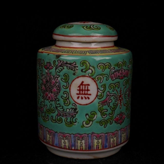 This is a charming vintage Chinese porcelain covered jar, beautifully decorated on a vibrant turquoise (pale green)...