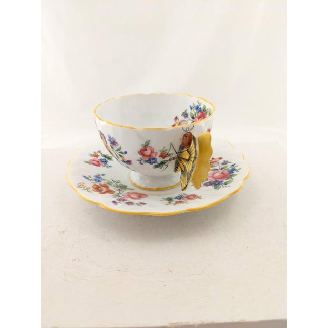 Rare vintage Aynsley teacup and saucer with beautiful yellow butterfly handle and floral design. Each image is hand...