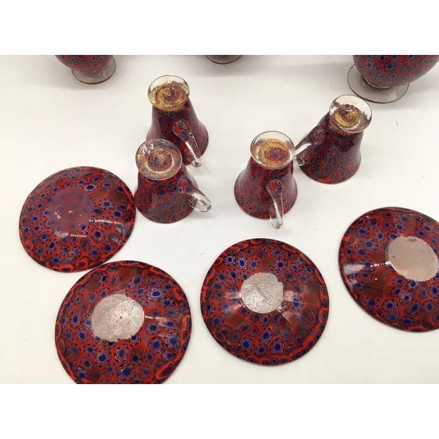 Beautiful Murano coffee set consists of 4 cups of which one with a fault, a sugar with lid, a carafe and a carafe with a...