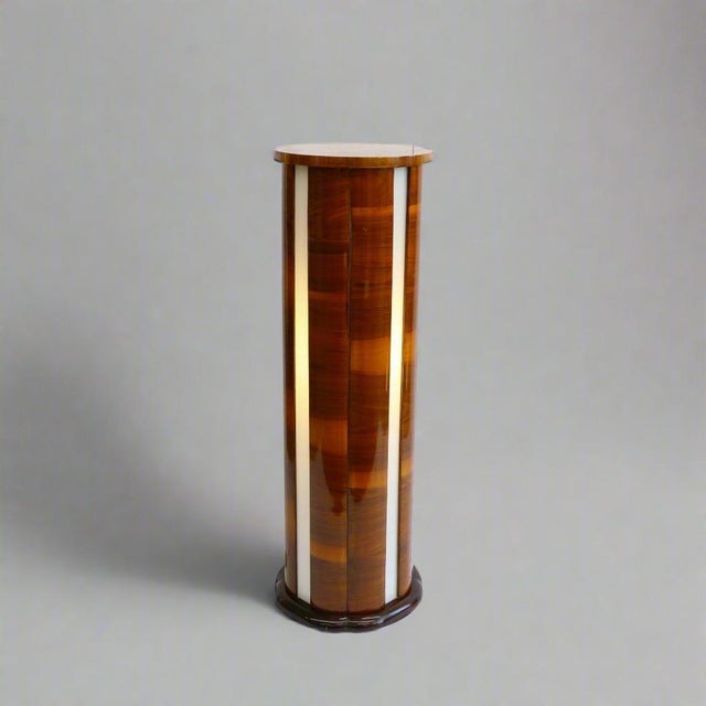 An Art Deco illuminated pedestal. French walnut with four illuminated frosted glass panels.
