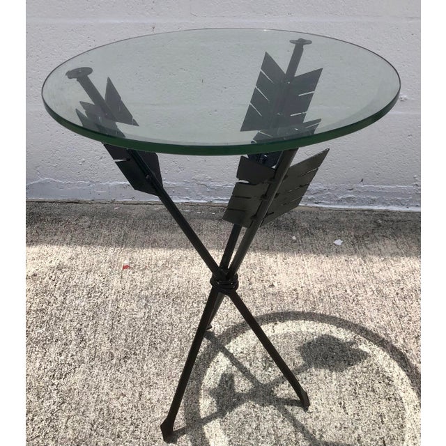 Wonderful vintage mid century black iron arrow table with thick beveled glass top. Circa 1970s. Wonderful Condition with...