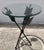 Wonderful vintage mid century black iron arrow table with thick beveled glass top. Circa 1970s. Wonderful Condition with...