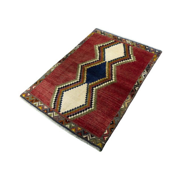 This hand-knotted Gabbeh nomad rug is an expressive, unique piece, crafted from pure, high-quality wool. The geometric...