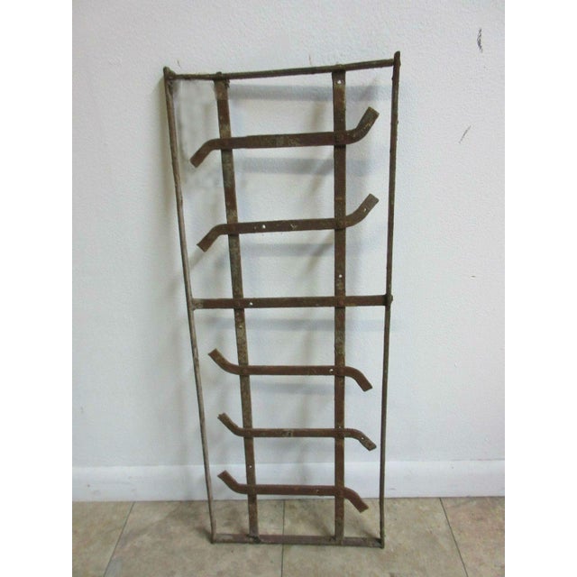 This iron window is a wonderful piece of architecture and is heavy, tight, and sturdy. The piece does shown signs of wear...